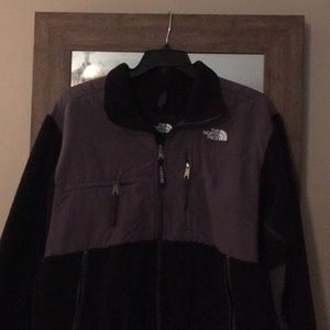 Black and dark grey North Face jacket
